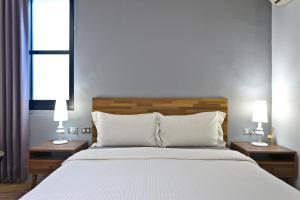 Łóżko lub łóżka w pokoju w obiekcie Kenting Cozy B&B