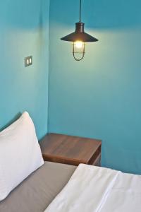 Łóżko lub łóżka w pokoju w obiekcie Kenting Cozy B&B