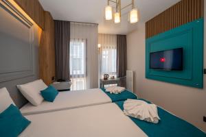 Ένα ή περισσότερα κρεβάτια σε δωμάτιο στο Lynda Hotel +38 φωτογραφίες