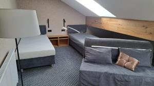 Tempat tidur dalam kamar di Residence Alpina