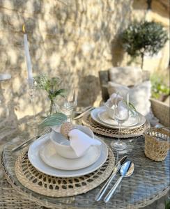 a table with plates and silverware on top of it at Greystone Guesthouse in Titchmarsh +21 photos