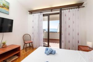 Ένα ή περισσότερα κρεβάτια σε δωμάτιο στο Apartment Majnaric by EL-PI TOURS