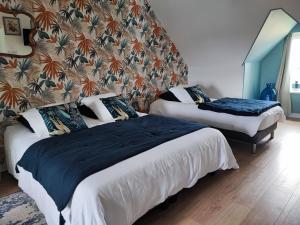 מיטה או מיטות בחדר ב-Chambres d'Hôtes "Les Hauts Vents"