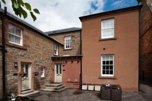 a large brick building with a door and windows at School View in Melrose