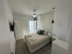 Posteľ alebo postele v izbe v ubytovaní Apartamento con jardín privado