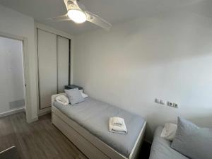 Posteľ alebo postele v izbe v ubytovaní Apartamento con jardín privado