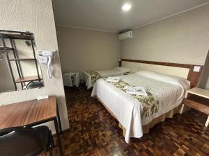 Postel nebo postele na pokoji v ubytování Hotel Pax