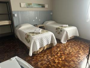 Postel nebo postele na pokoji v ubytování Hotel Pax