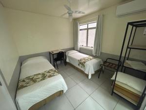 Postel nebo postele na pokoji v ubytování Hotel Pax