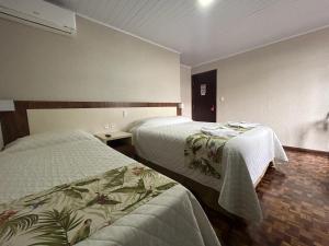 Postel nebo postele na pokoji v ubytování Hotel Pax