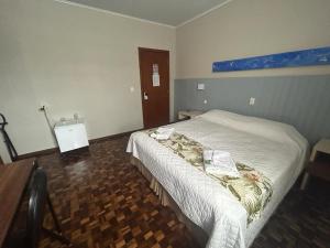 Postel nebo postele na pokoji v ubytování Hotel Pax