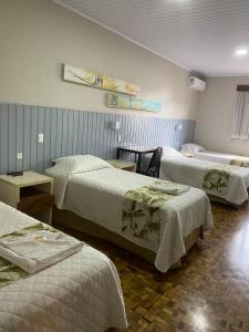Postel nebo postele na pokoji v ubytování Hotel Pax