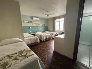 Postel nebo postele na pokoji v ubytování Hotel Pax
