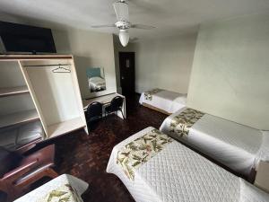 Postel nebo postele na pokoji v ubytování Hotel Pax