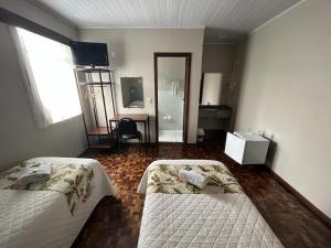 Postel nebo postele na pokoji v ubytování Hotel Pax