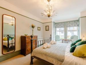 a bedroom with a bed and a large mirror at 3 bed in Broadstairs 86736 in Broadstairs