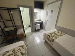 Postel nebo postele na pokoji v ubytování Hotel Pax
