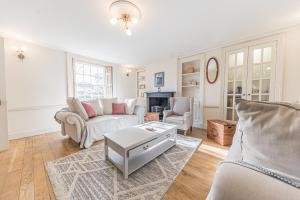 a living room with a couch and a table at Central Kendal Georgian Home with private courtyard & free parking in Kendal