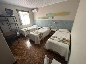 Postel nebo postele na pokoji v ubytování Hotel Pax