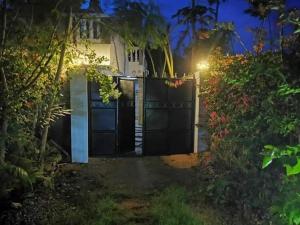 a gate to a house at night at Mtwapa Empire holiday Apartments in Mtwapa