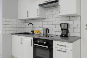 Kuchyňa alebo kuchynka v ubytovaní Apartamenty Horyzont SeaView by Rent like home