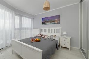 Posteľ alebo postele v izbe v ubytovaní Apartamenty Horyzont SeaView by Rent like home