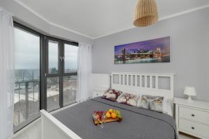 Posteľ alebo postele v izbe v ubytovaní Apartamenty Horyzont SeaView by Rent like home