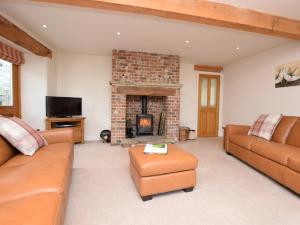 a living room with a couch and a fireplace at 3 bed in Cressbrook 57037 in Cressbrook