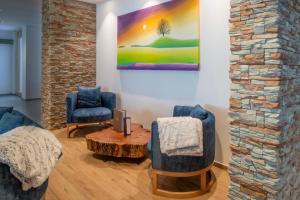 Posezení v ubytování Boutique hôtel Corbetta - SPA 60m2 - La montagne à 5 minutes de l'autoroute A12 aux Paccots sur Montreux - NOUVEAU Loft familial - Profitez du Lac Léman et des montagnes en même temps