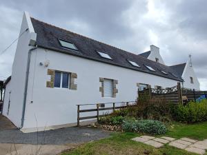 a white house with a black roof at LES HAUTS VENTS in Saint-Pol-de-Léon