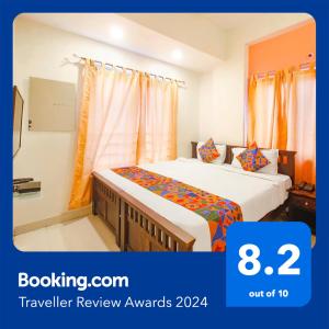 a hotel room with two beds and a window at FabExpress Corner Courtyard - Nr Botanical Garden, Kondapur in Kondapur