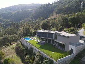 an aerial view of a house in the mountains at Villa Recanto de Fornelos, Gerês - Até 10 Pax in Geres