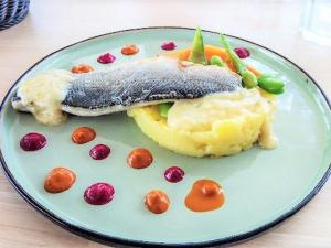 a plate of food with fish and mashed potatoes at Appartement Le Grau-du-Roi, 2 pièces, 4 personnes - FR-1-307-158 in Le Grau-du-Roi