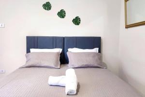 Postel nebo postele na pokoji v ubytování Linda Casa a 30 metros da av das Cataratas + 40 fotografií