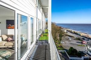 an apartment balcony with a view of the ocean at 19 Undercliffe in Felixstowe