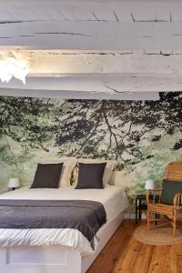 Ein Bett oder Betten in einem Zimmer der Unterkunft La Breizhidence