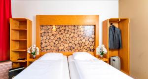 Postel nebo postele na pokoji v ubytování PLAZA INN Dachau - München