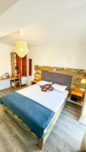 a bedroom with a large bed in a room at Boho House in Pakoštane