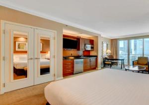 a large hotel room with a bed and a kitchen at Luxury Studio With Balcony At Las Vegas in Las Vegas