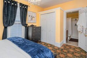 a bedroom with a bed and a window at Spacious upstairs 1bed- Walking distance to Beach outlet mall in Michigan City