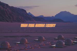 a group of domes sitting in the desert at Wadi rum anwar luxury camp in Wadi Rum