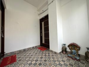 The Kaya Inn Srirangam客房内的一张或多张床位