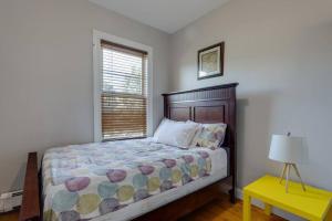 a bedroom with a bed and a window at NEW! Boston Condo Near MBTA, 3Mi to Fenway ! (U3) in Boston