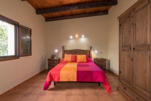 Giường trong phòng chung tại Hoya de la Cebada