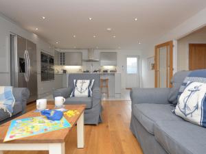 a living room with a couch and a table at 4 bed in Appledore 76483 in Appledore