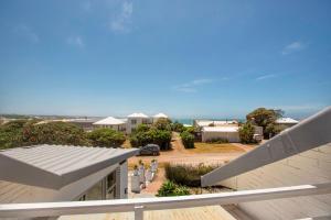 a view of the ocean from the balcony of a house at Tranquility in Cape St Francis