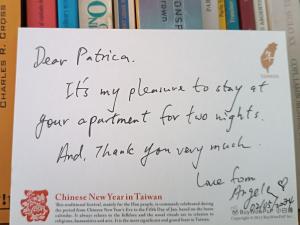 a handwritten letter on top of books at Lavalle Studio Buenos Aires in Buenos Aires