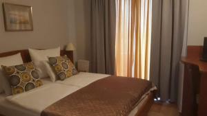 Postel nebo postele na pokoji v ubytování Aparthotel Lekavski