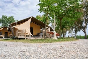 a house with a tent on the side of a road at Glamping Costa Brava in Fortiá +44 photos