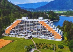 an aerial view of a large building next to a lake at Seewohnung Landskron-Ossiachersee in Villach